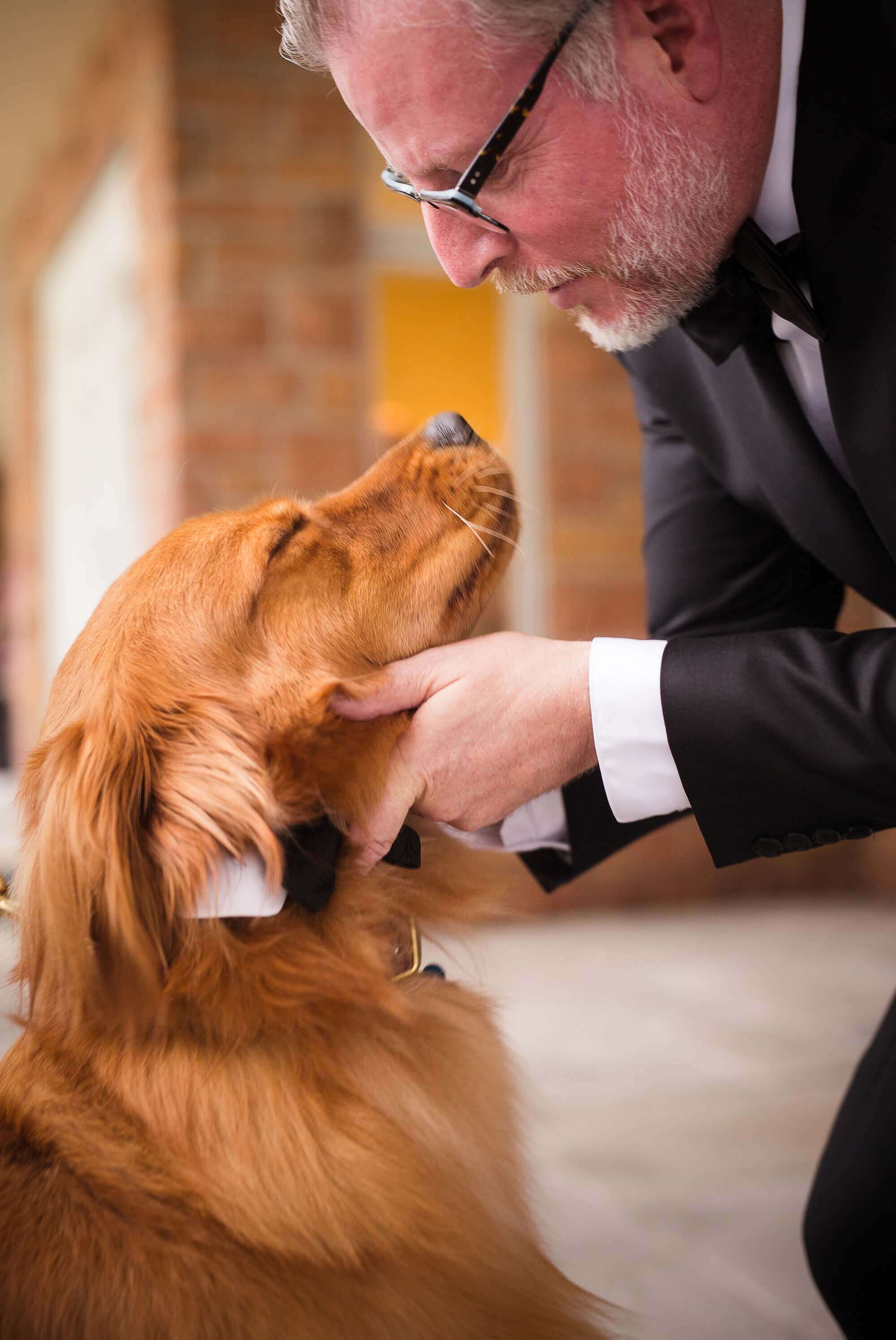 The groom and a dog before the ceremony at Lambton Golf & Country Club