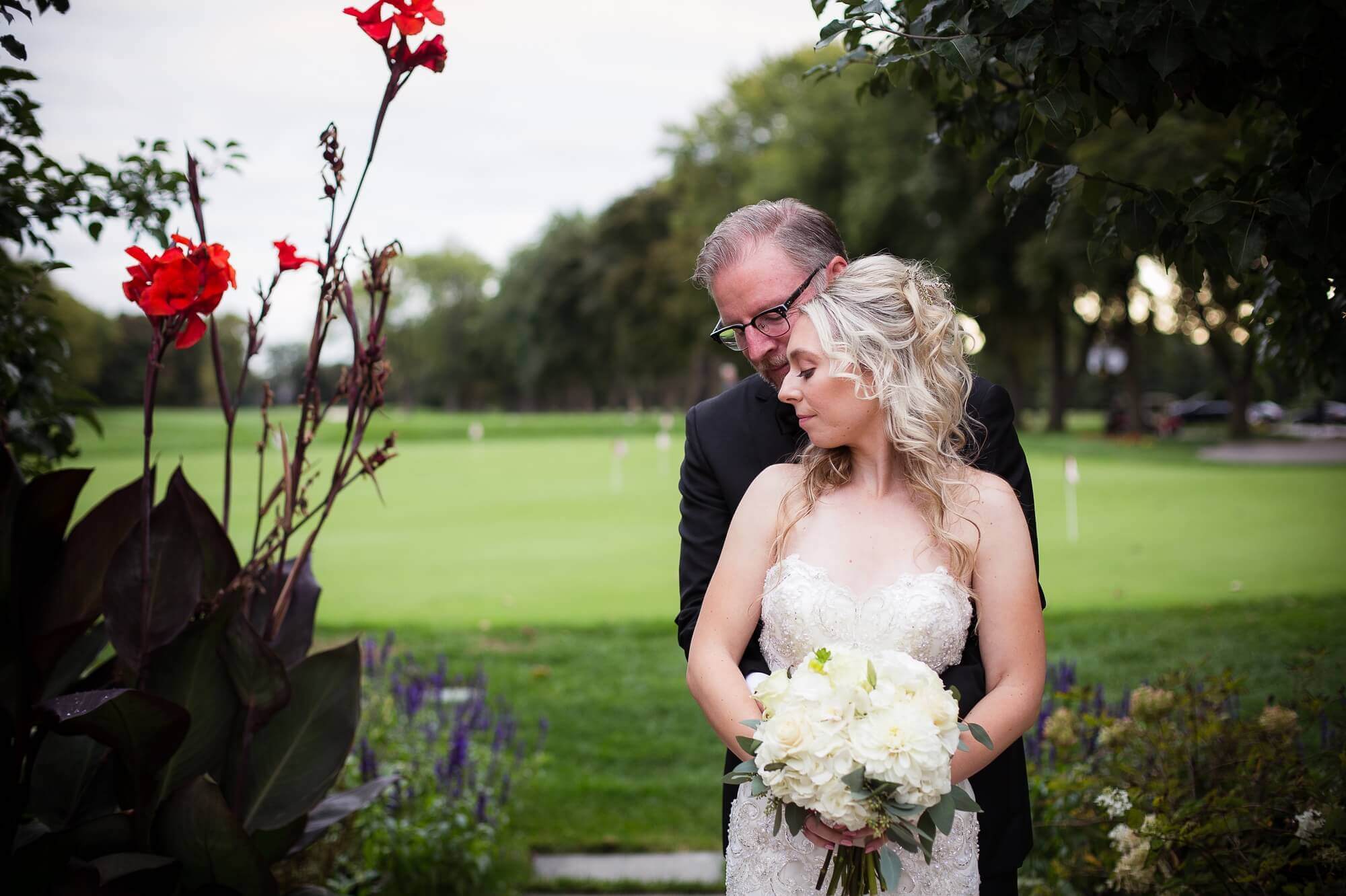 Beautiful portrait of the bride and groom in the Lambton Golf & Country Club gardens 