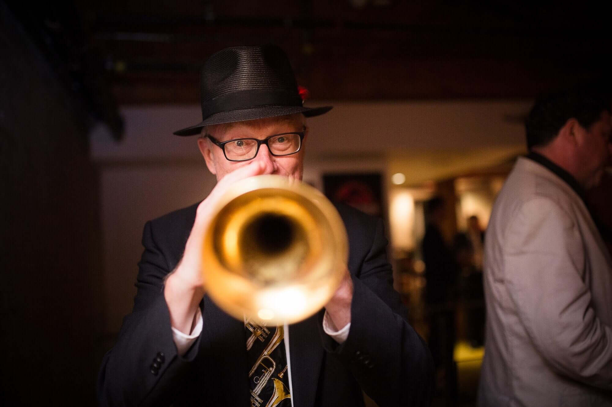 Creative portrait of the trumpet player at the boho wedding at Hotel Ocho, Toronto
