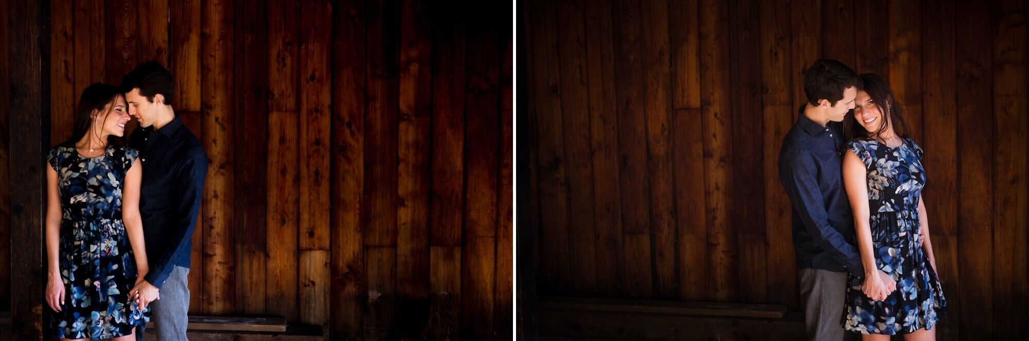 The couple is posed in front of rustic barn wood for a Toronto engagement session
