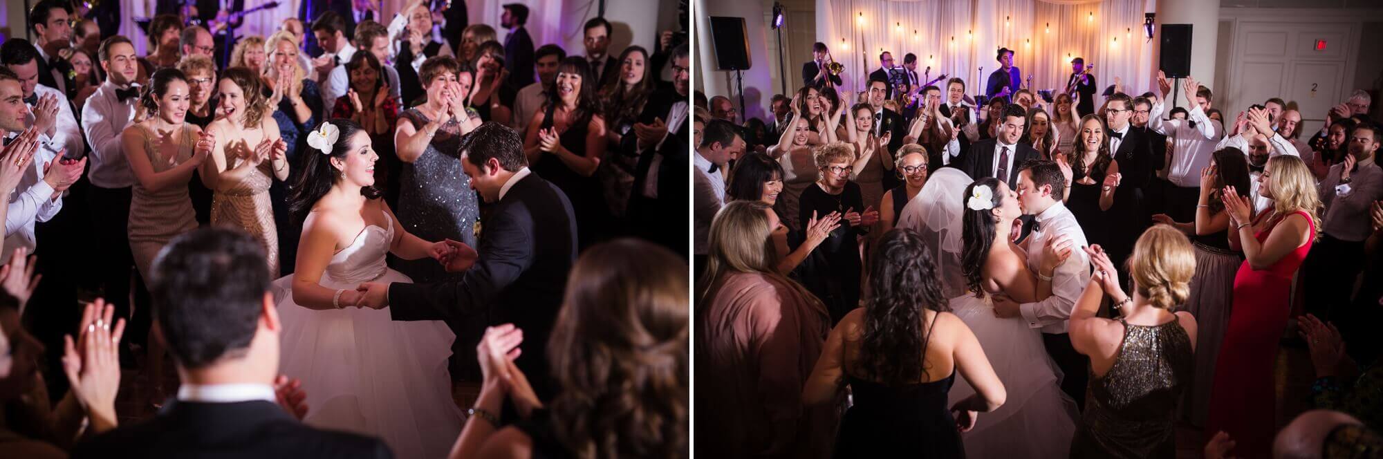 Portraits of the bride and groom kissing on the dance floor surrounded by their guests at the Omni King Edward Hotel in Toronto