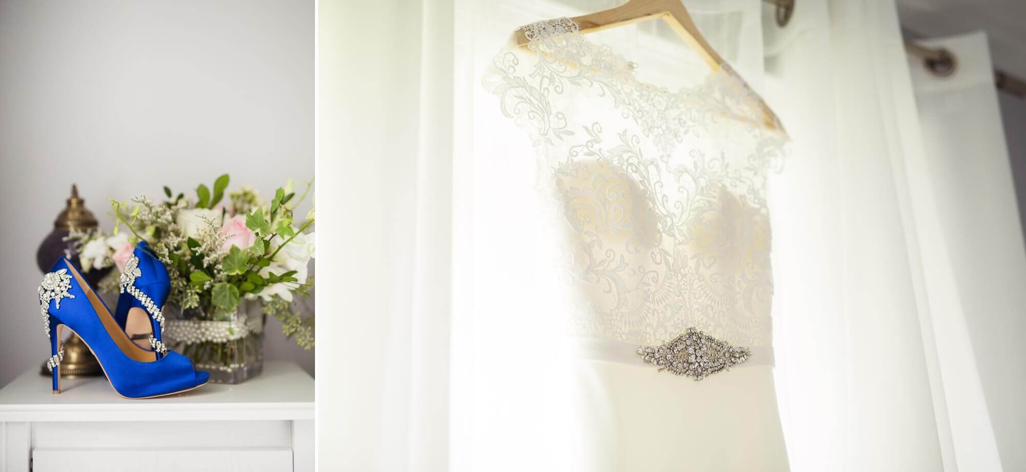 Details of the brides blue wedding shoes and wedding dress elegantly hung in the window
