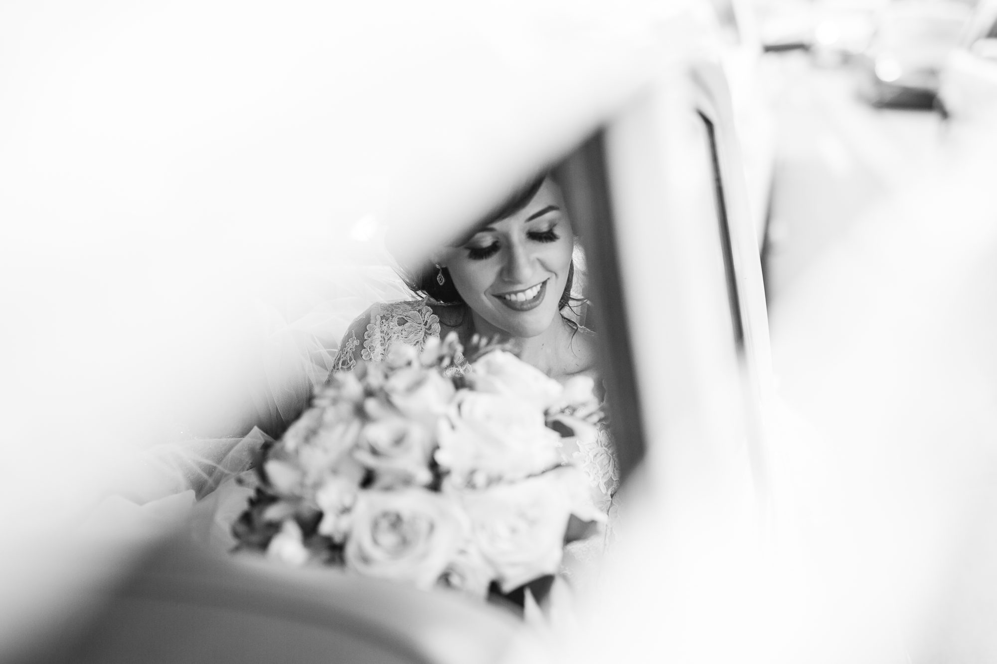 Elegant portrait of the bride arriving in her car to the wedding ceremony at Our Lady of Lebanon